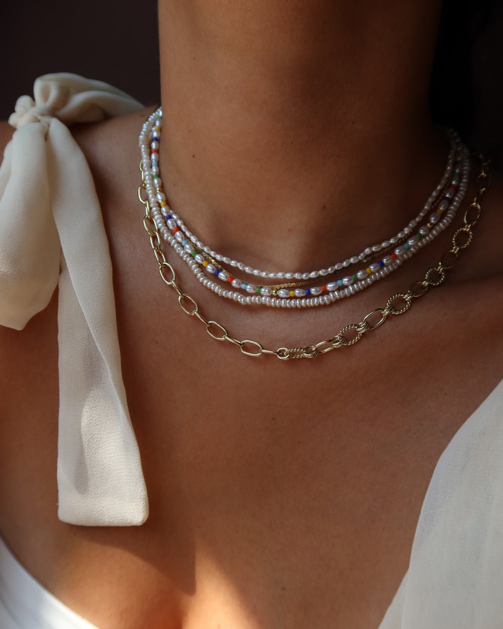 Button pearl necklace deals